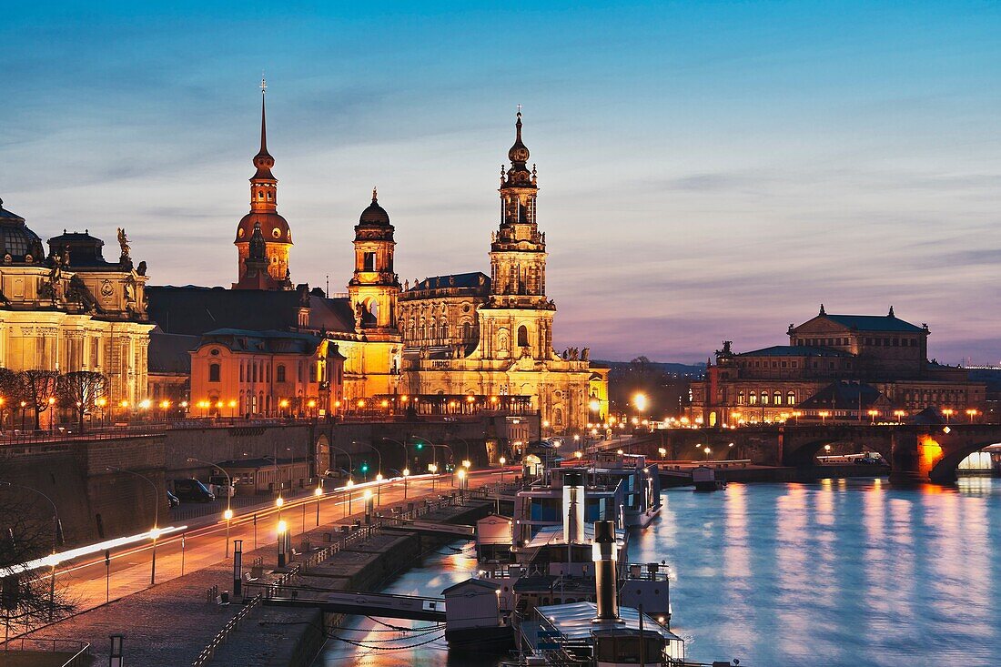 View over Elbe river to Bruehls Terrace, the academy of arts, house of the estates, Hausmannsturm tower, the Catholic Church of the Royal Court of Saxony, the Semper Opera House and Augustus bridge from left to right Dresden, Saxony, Germany, Europe