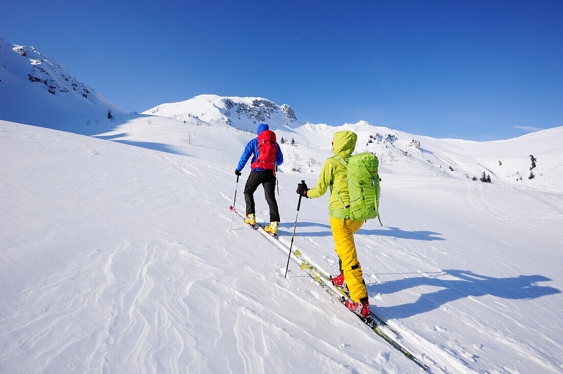 Two cross-country skier ascending to mount Sulzspitze, Tannheim Mountains, Allgaeu Alps, Tyrol, Austria