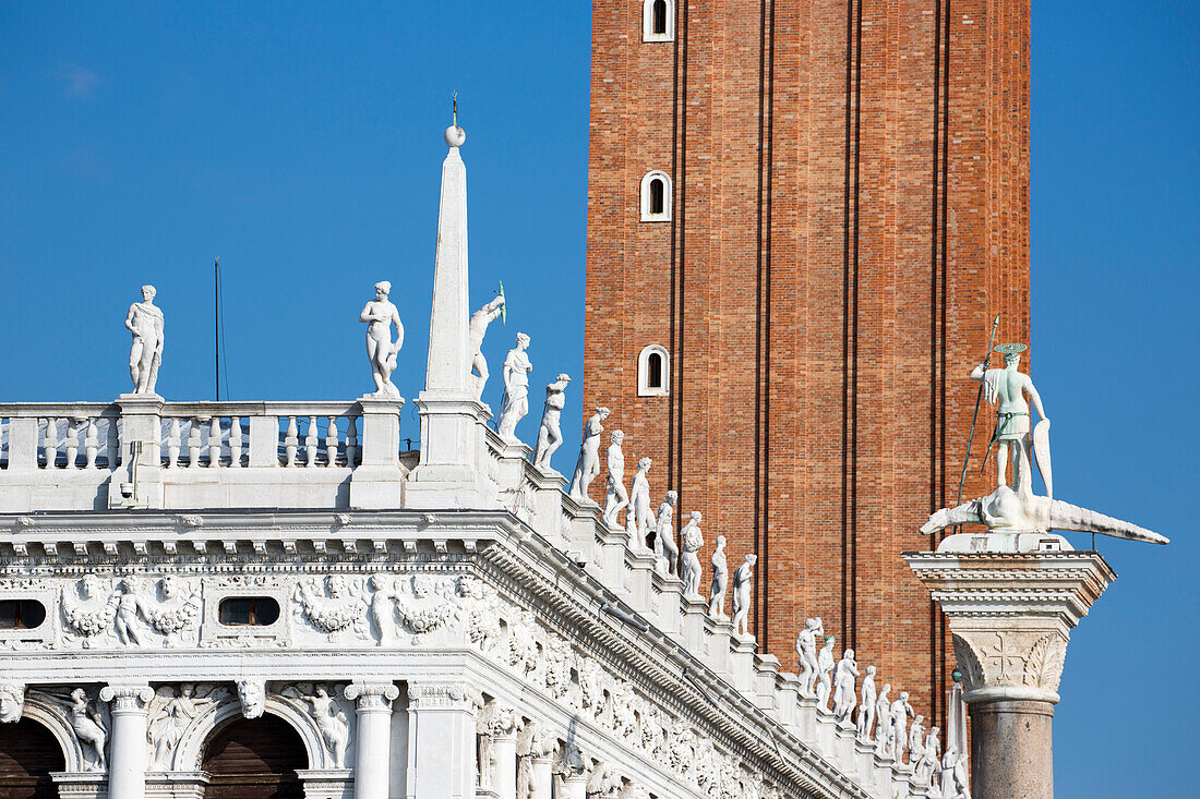 Statues of Libreria Nazionale Marciana and Campanile tower on Piazza San Marco, Venice, Veneto, Italy, Europe
