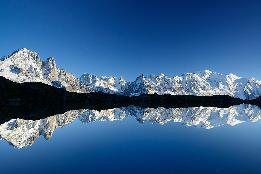 Mont Blanc range reflecting in a mountain lake, Mont Blanc range, Chamonix, Savoy, France