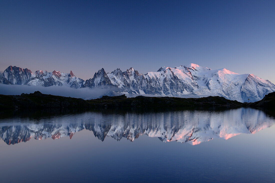 Mont Blanc range reflecting in mountain lake, Mont blanc range, Chamonix, Savoy, France