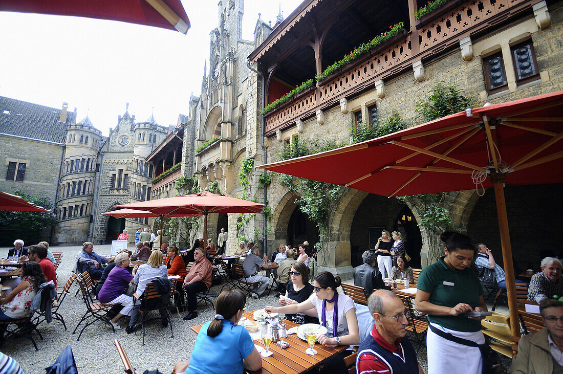 People in the inner courtyard of the Marienburg castle, Marienburg, Hildesheim, Lower Saxony, Germany, Europe