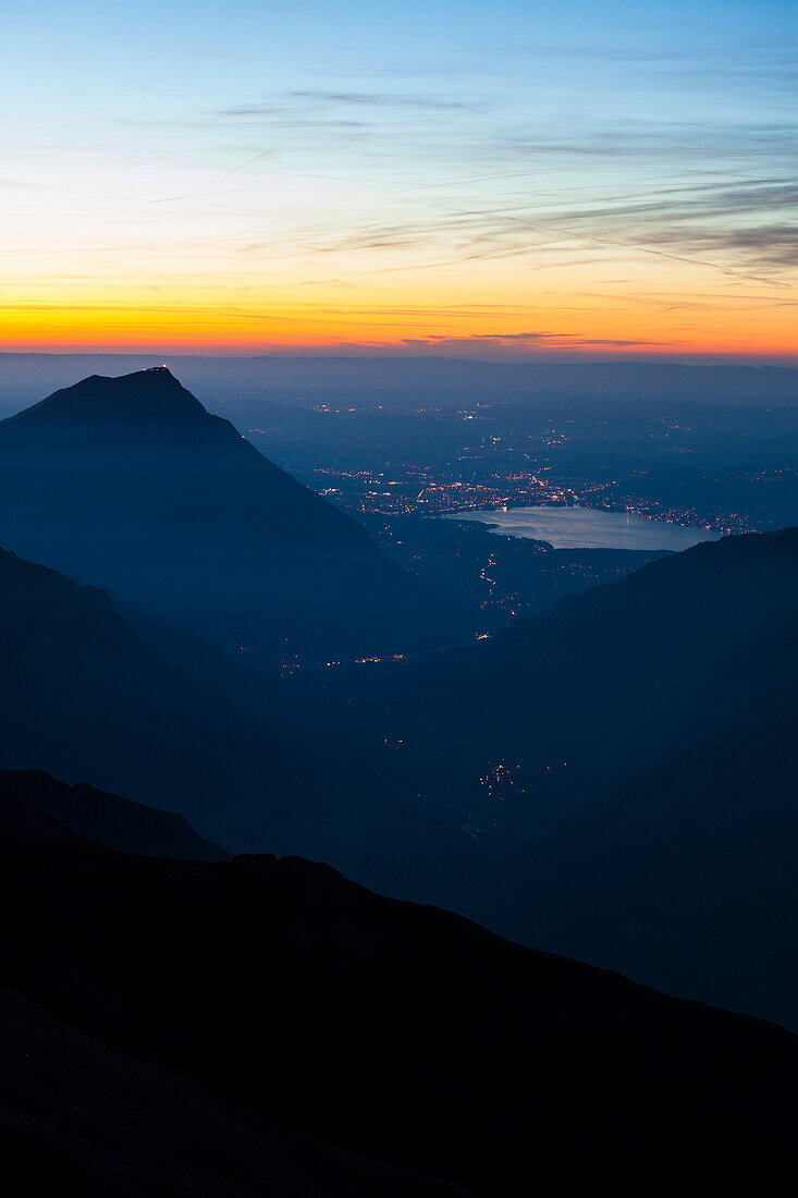 Dusk high above lake Thunersee, view from Blueemlisalp hut towards Mount Niesen, Bernese Oberland, Canton of Bern, Switzerland