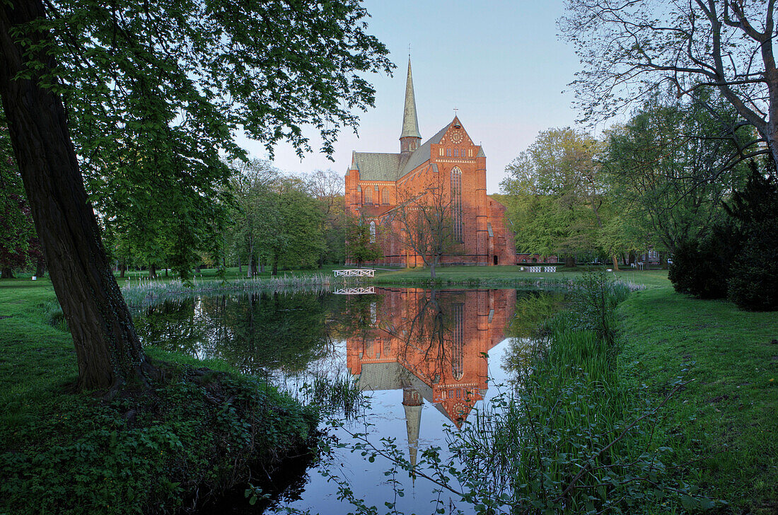 Reflection of the minster on pond, Bad Doberan, Mecklenburg Western Pomerania, Germany, Europe