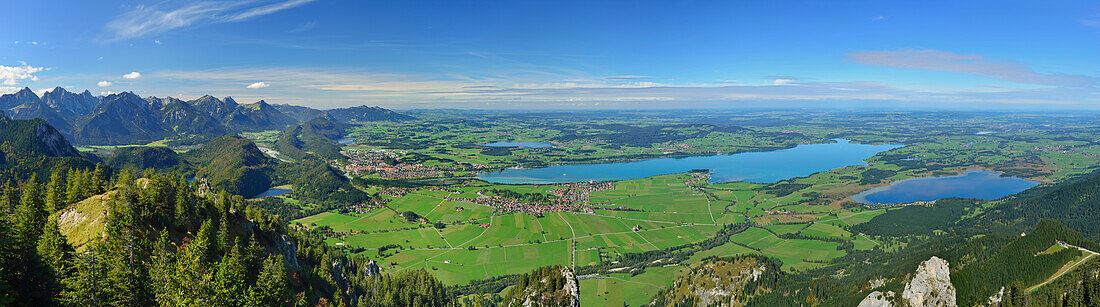 Panorama from Tegelberg with view towards Tannheimer range, Fuessen, lake Forggensee and lake Bannwaldsee, Tegelberg, Ammergau range, Allgaeu, Swabia, Bavaria, Germany