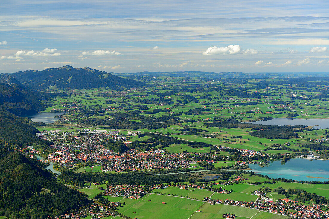 View towards Fuessen, Allgaeu range, lake Weissensee, lake Forggensee and lake Bannwaldsee, Tegelberg, Ammergau range, Allgaeu, Swabia, Bavaria, Germany