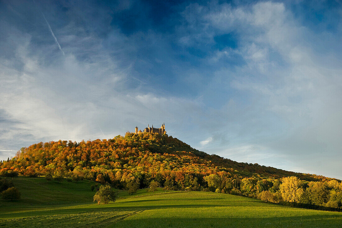 View of Hohenzollern Castle under clouded sky, Hechingen, Swabian Alp, Baden-Wuerttemberg, Germany, Europe