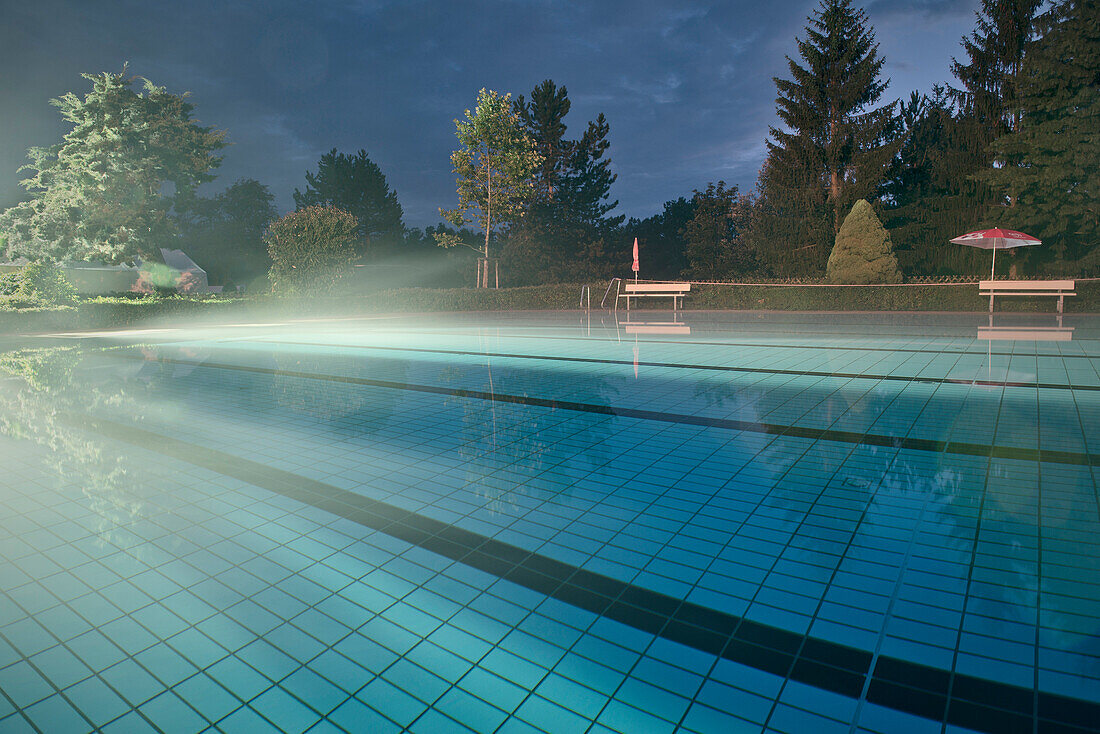 Fog at water surface at open air swimming pool Baden-Wuerttemberg, Germany