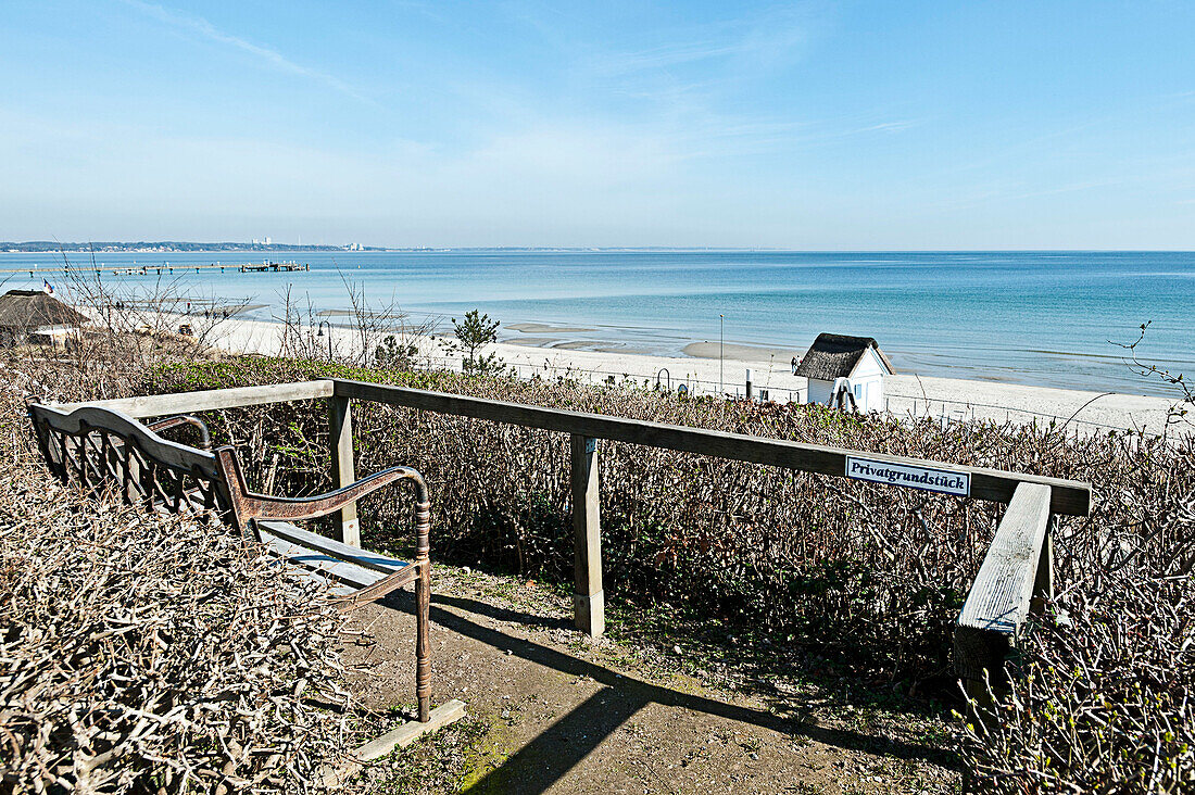 Bench with view towards sandy beach, Scharbeutz, Schleswig Holstein, Germany