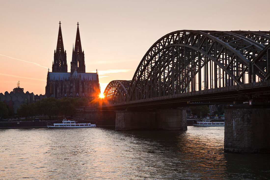 Cathedral and Hohenzollern bridge at sunset, Cologne, North Rhine-Westphalia, Germany, Europe