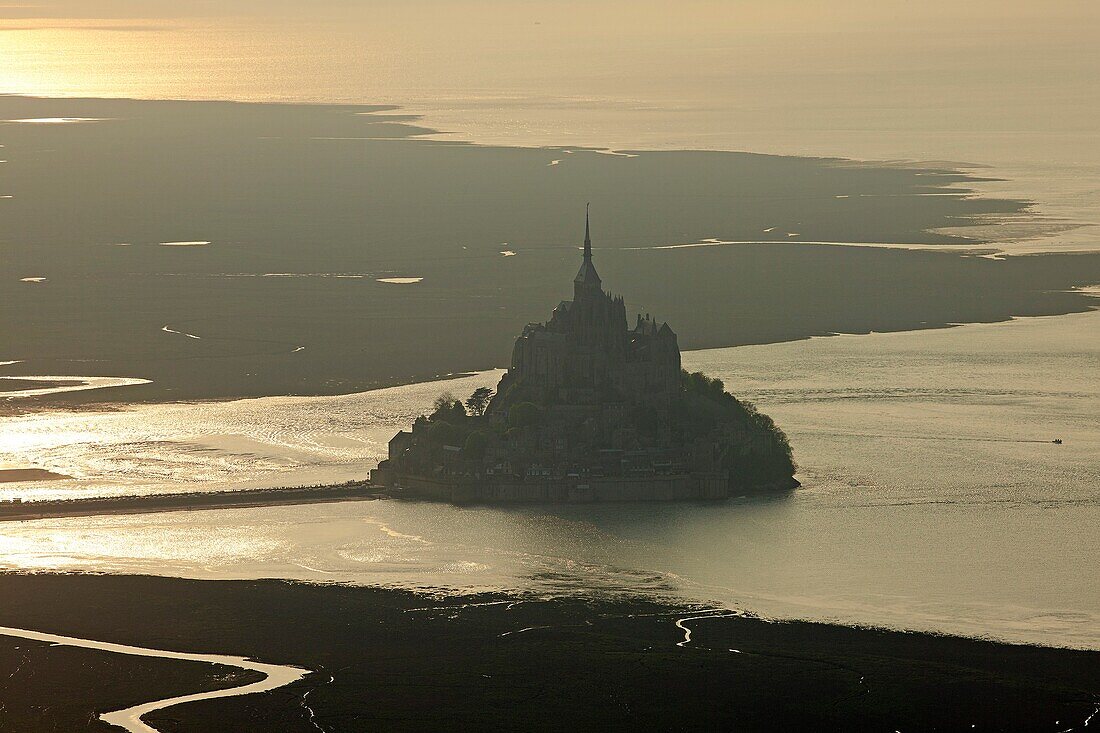 France, Ille-et-Vilaine (35), Mont Saint Michel, a World Heritage Site by UNESCO, the bay against golden day, (aerial photo)