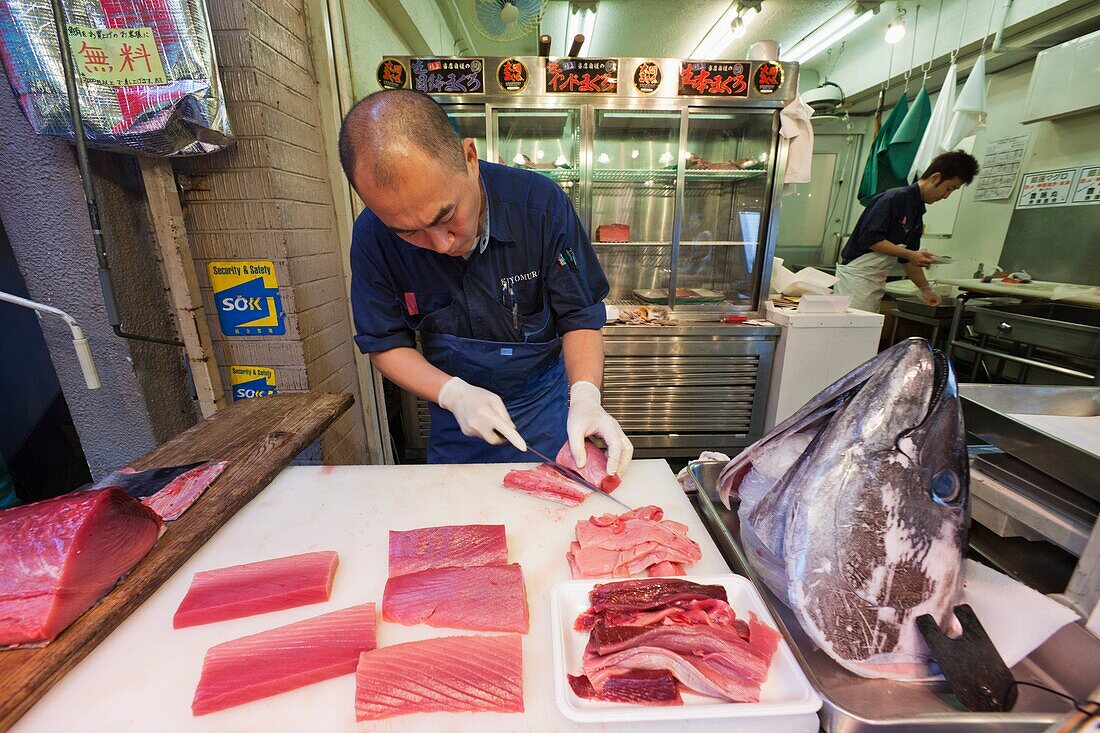 Japan,Tokyo,Tsukiji Market,Fishmonger Slicing Tuna