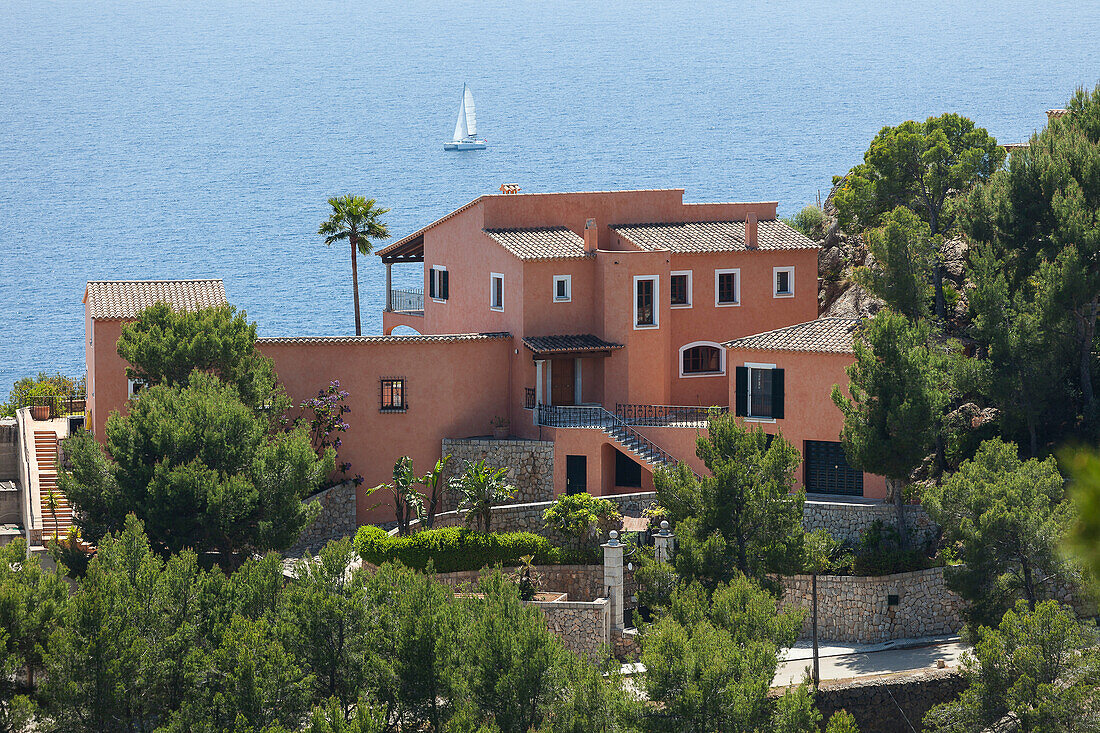 Mansion and sailing boat at Mediterranean coast, Andratx, Mallorca, Spain