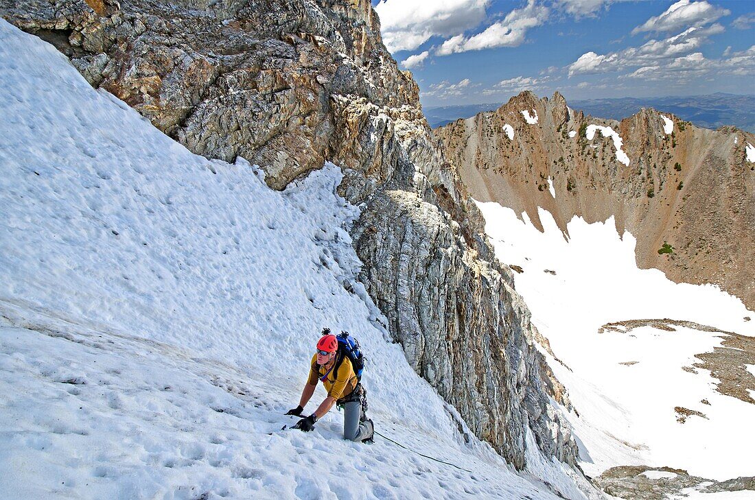 Mark Weber climbing The June Couloir on the North Face of Williams Peak high above the Sawtooth Valley in the Sawtooth Mountains near the town of Stanley in central Idaho