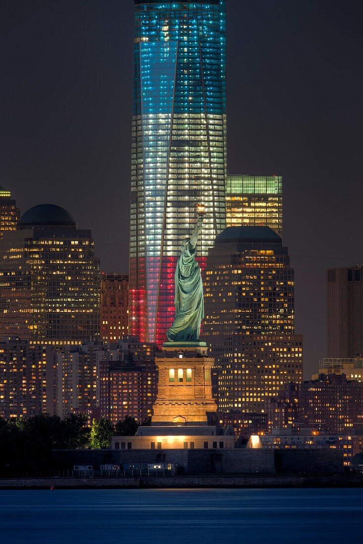The Statue of Liberty and the Freedom Tower One World Trade Center in New York City represent two symbols of freedom on Tuesday, September 11, 2012 near the lights of the Tribute in Light, an annual memorial to the events of September 11, 2001. The Freedo