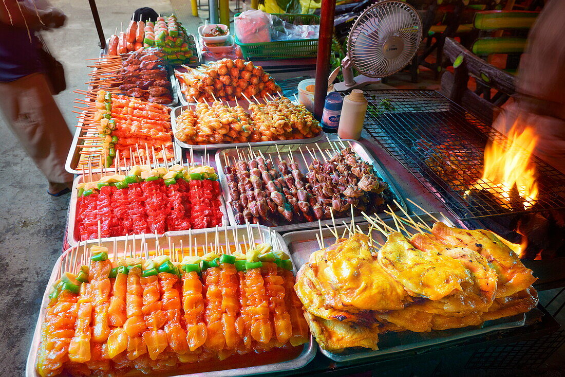 Thailand, Phuket Island, Patong Beach, street stall with meat skewers ready to grill