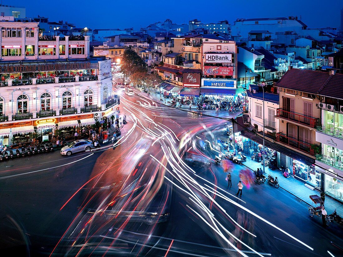 Cars, motorbikes, and pedestrians converge at the busy intersection of Dinh Tien Hoang and Hang Dao streets  Hanoi, a city of 6 5 million people, is projected to become one of the world´s fastest growing cities in the next decade and just recently celebra