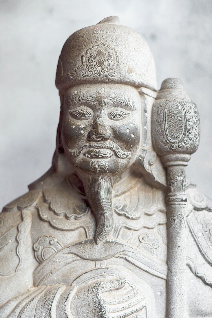 An ornate Confucius statue at The Temple of Literature