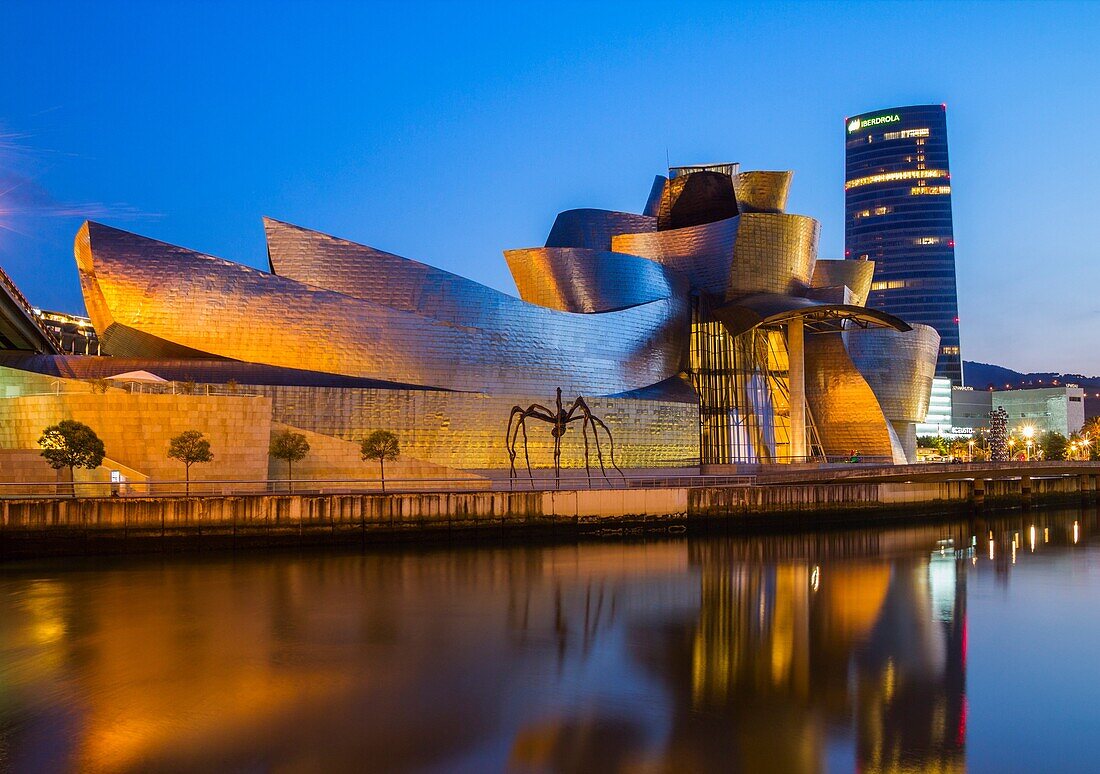 Guggenheim museum in Bilbao  Iberdrola Tower in background  Bilbao, Basque Country, Spain