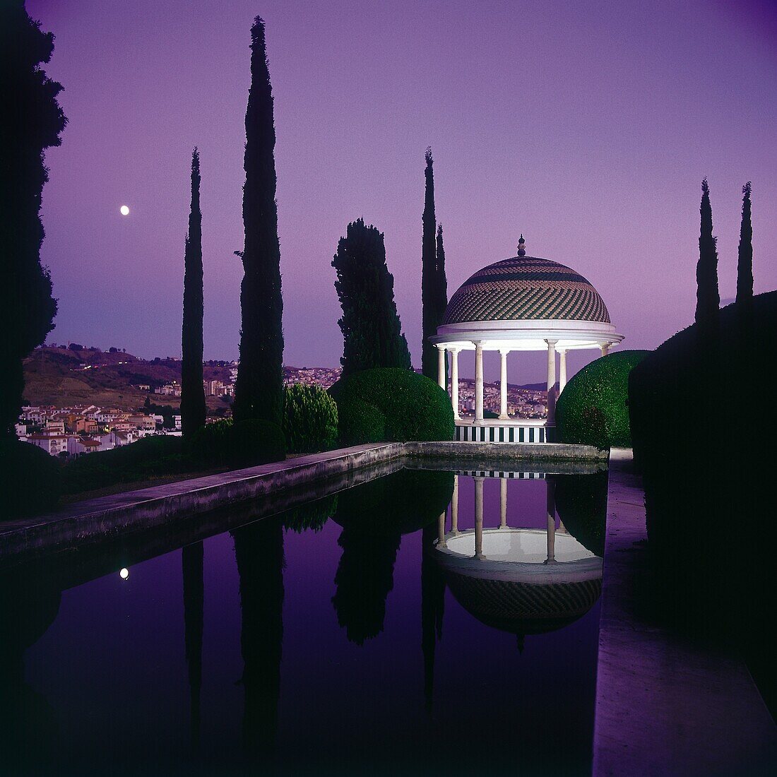 Night view of the ´Mirador de Echevarria-Echevarrieta´ reflection in pond, the bottom view of Malaga  Historical Botanical Garden ´La ConcepciÃ³n´ Malaga, Andalusia, Spain, Europe