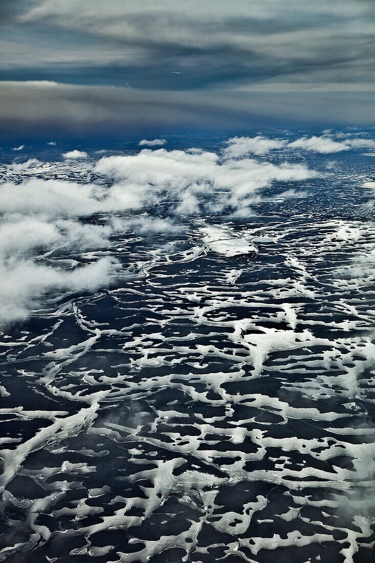 Grimsvotn Volcanic Eruption in the Vatnajokull Glacier, Iceland  Ash seen in the clouds, snow, ice and river beds approx 20-40 kilometers away  The eruption began on May 21, 2011 spewing tons of ash, initially the plume was over 20 kilometers high  Volcan