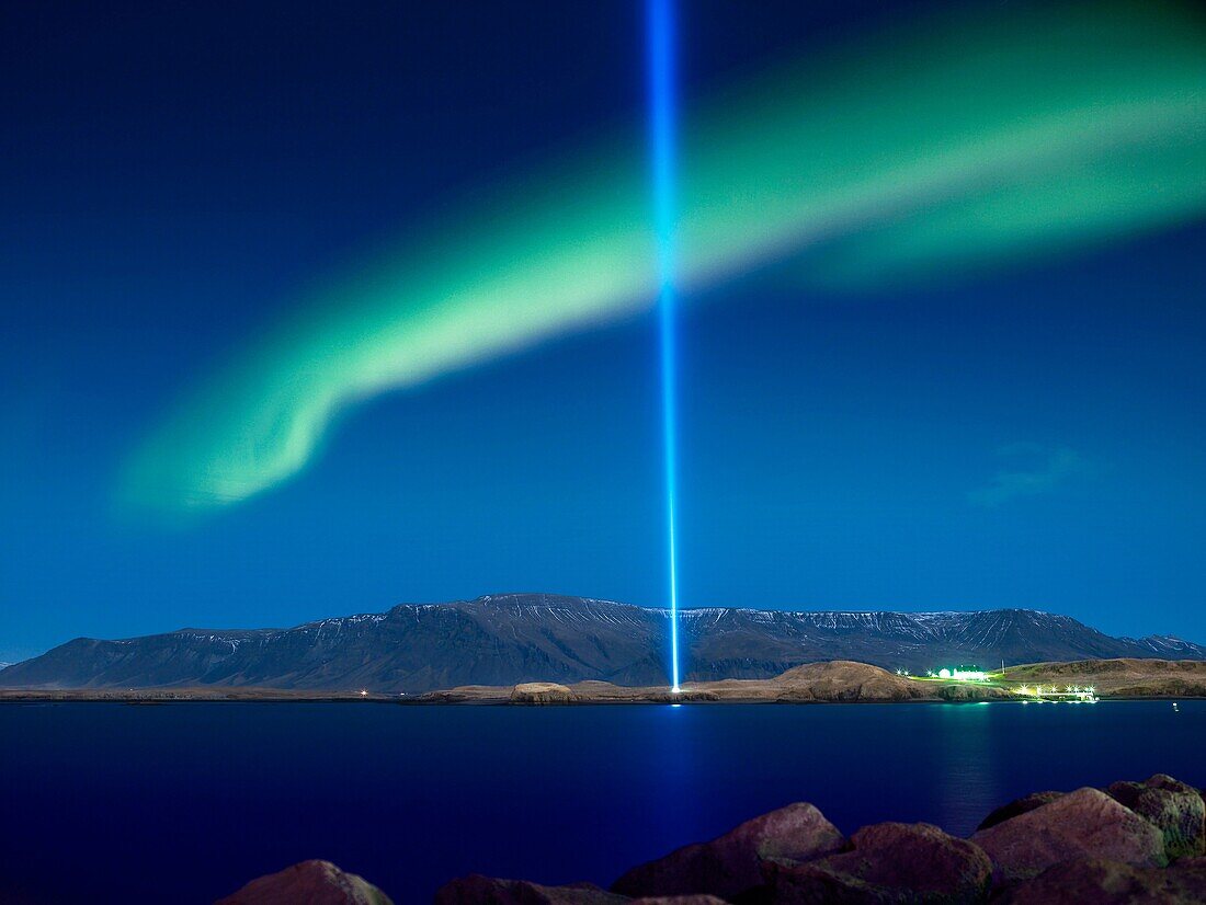 Imagine Peace tower with Aurora Borealis The Imagine Peace Tower, a memorial to John Lennon from Yoko Ono, located on Videy Island, Reykjavik, Iceland  It consists of a tall ´tower of light´, projected from a white stone well which has the words ´Imagine.