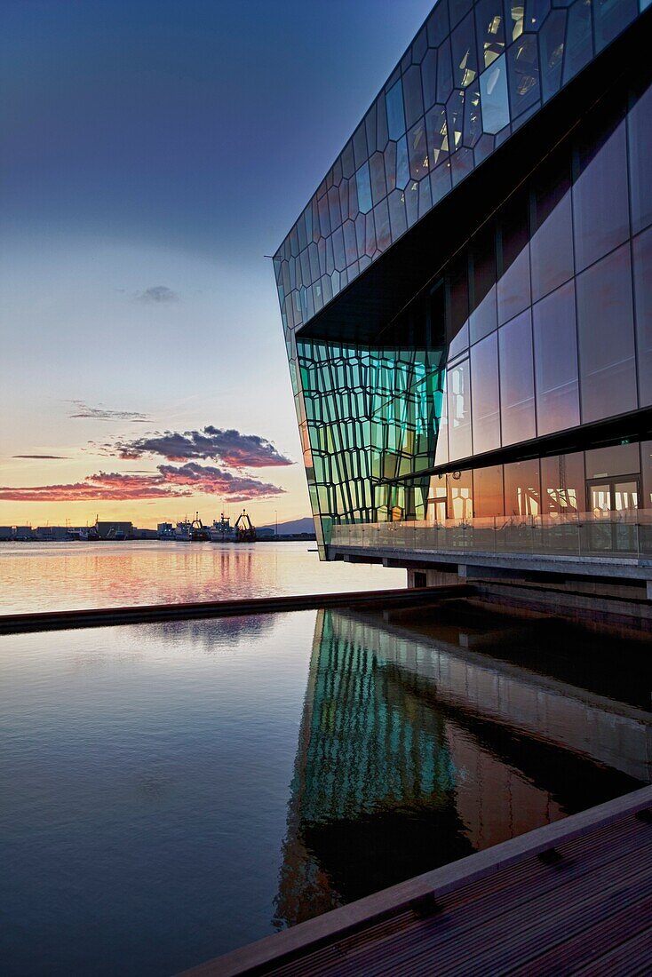 Harpa Concert Hall and Conference Center, Reykjavik Iceland  Situated on the boundary between land and sea, the building is a gleaming sculpture reflecting both sky and harbor  The glass facade was designed by Olafur Eliasson in collaboration with Henning