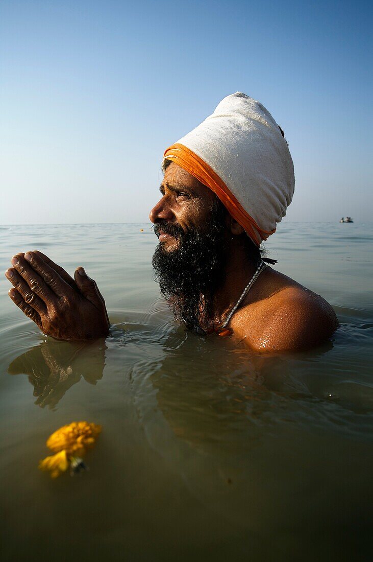 Pilgrim bathing at the confluence of the river Ganges and the Bay of Bengal , Sagar Mela, India, Ganges River