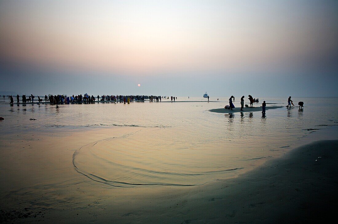 Pilgrims bathing at the confluence of the river Ganges and the Bay of Bengal , Sagar Mela, India, Ganges River