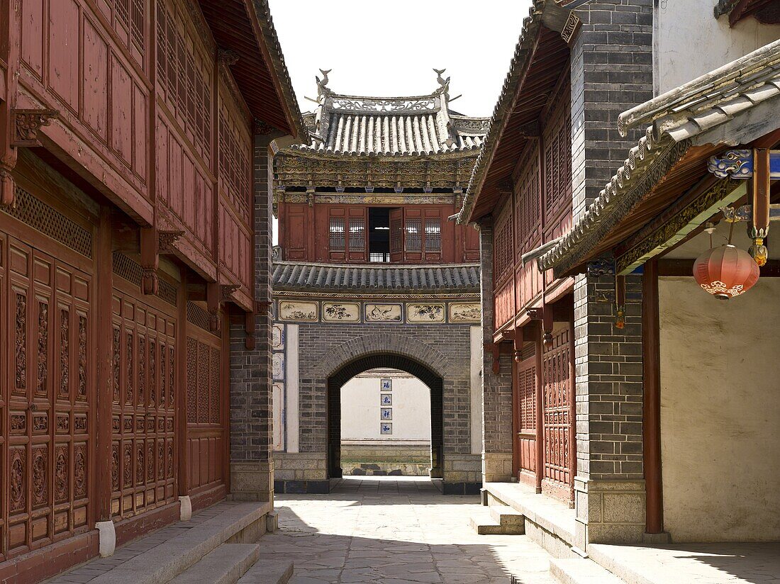 The Building Gate is delicate and profound  It has the smack of a palace or a pavilion in Central China with double eaves and raised corners  The upper part of the door frame, eaves plank and lintel are made of wood  The base of the Gate is made of bricks
