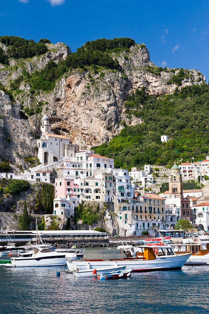 Boats in the harbour and a view of the town of Amalfi on the Gulf of Salerno in southern Italy