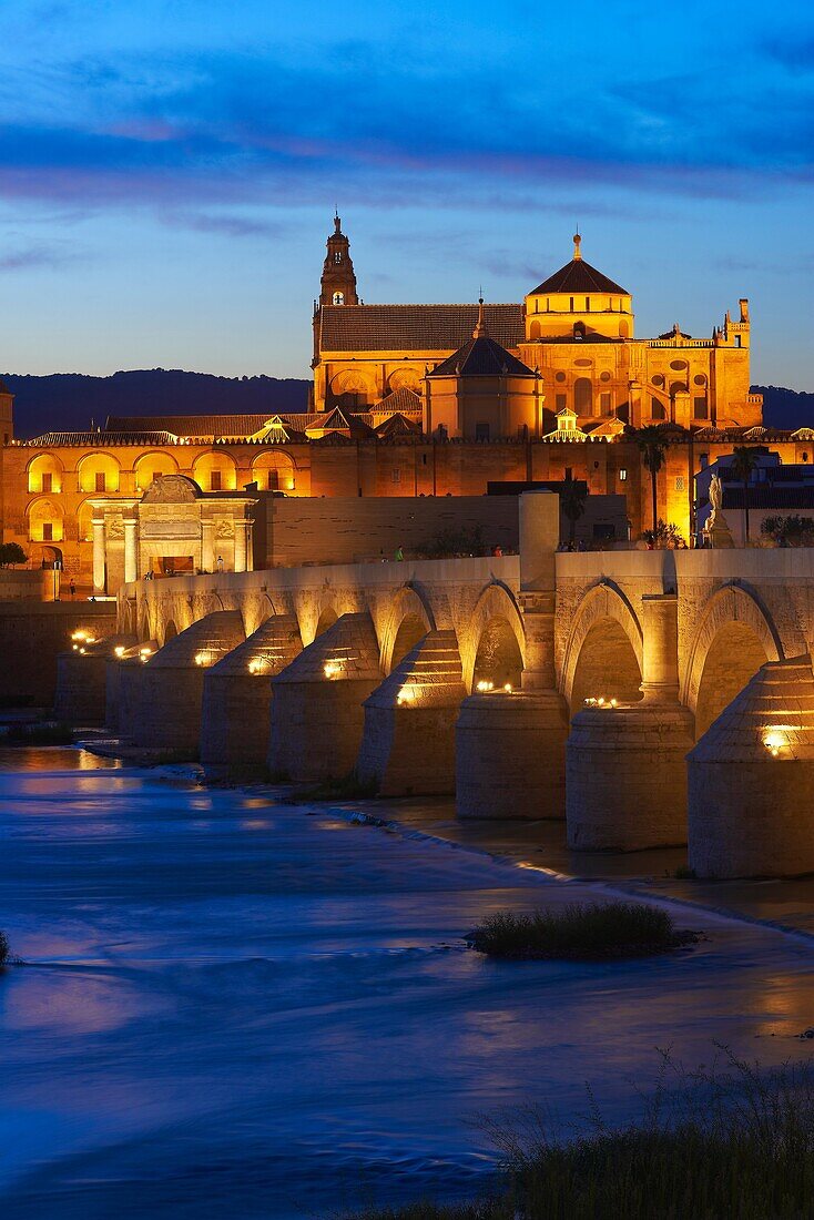 Guadalquivir river, Roman bridge and mosque-cathedral at Dusk  Córdoba  Andalusia  Spain