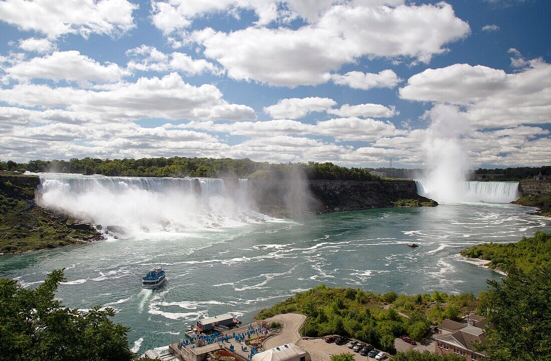 Niagara Falls, Ontario, Niagara Falls  The Maid of the Mist carries tourists wearing blue raincoats to the edge of the falls