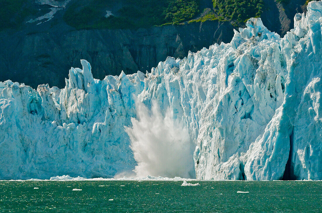 Ice calving off the face of Barry Glacier in Prince William Sound, Southcentral Alaska, Summer