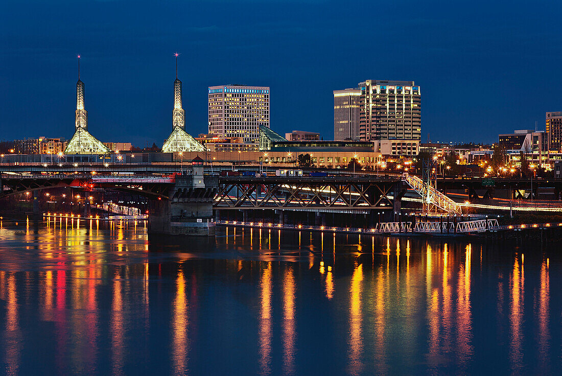 The Oregon Convention Center and downtown buildings of the east bank of the Willamette River