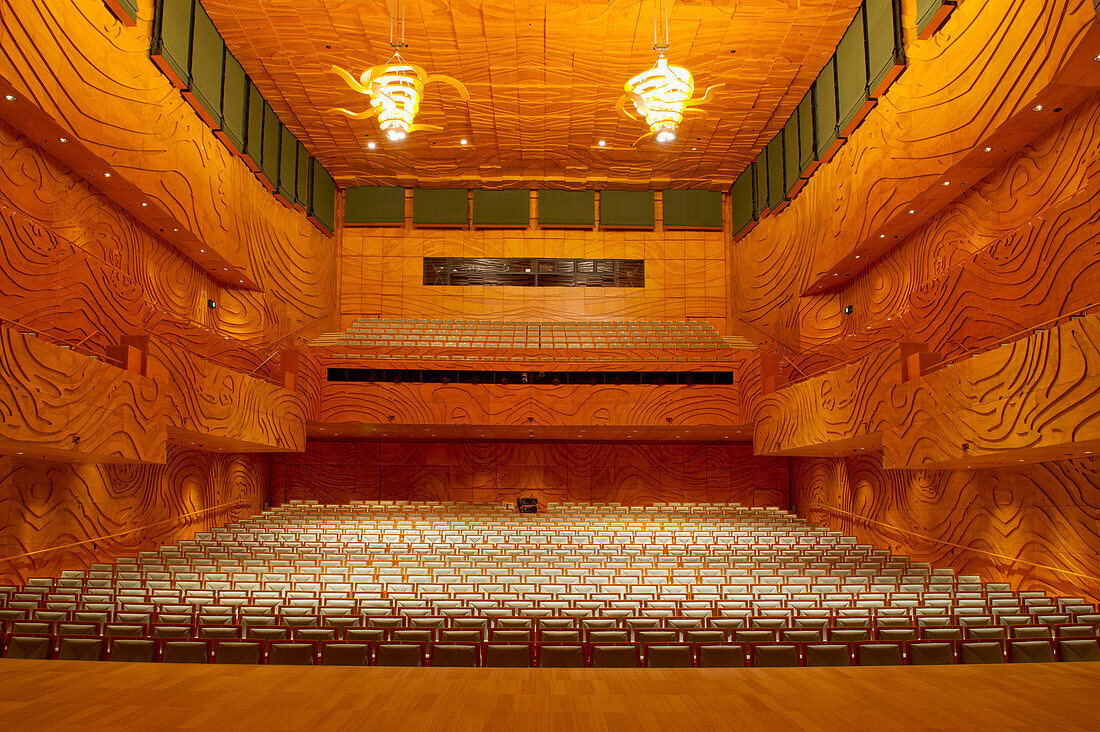 A concert hall auditorium, with rows of seats and tiered balconies.