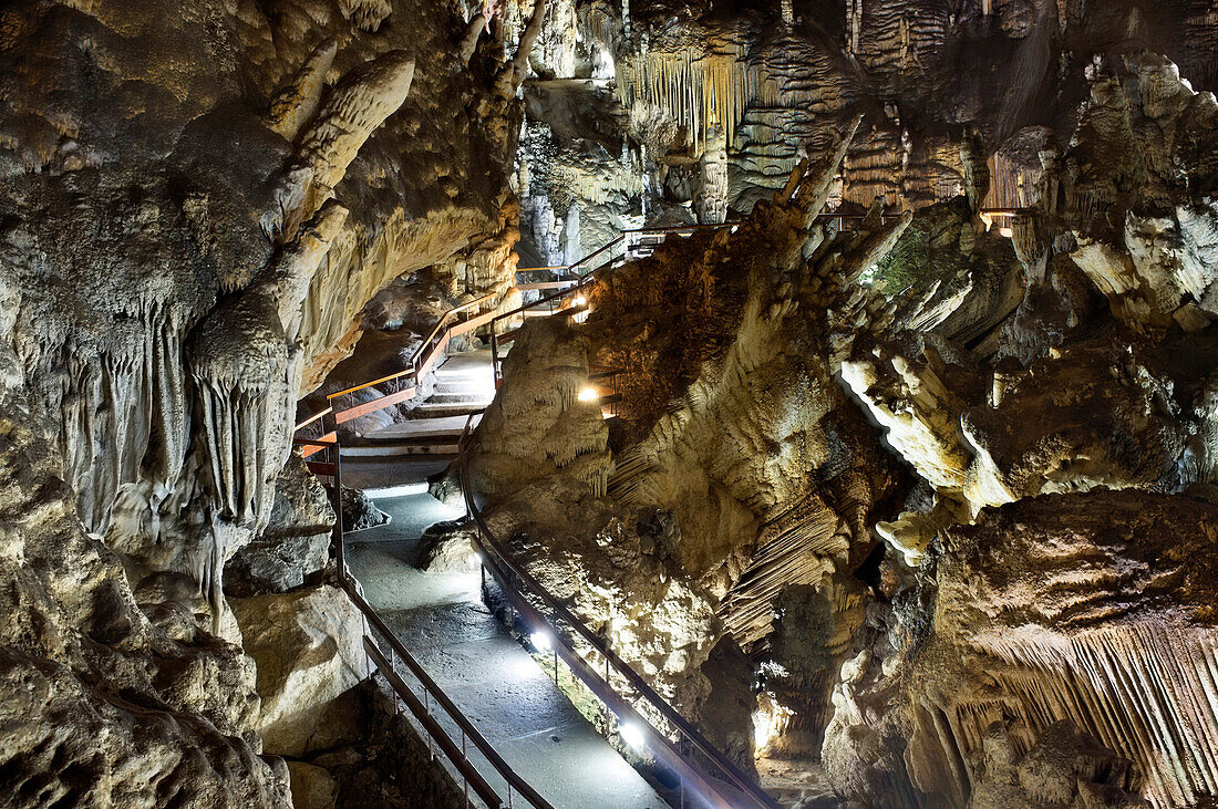 Route through the illuminated caves of Nerja, Spain, where the stalagmites and stalactites were created thousands of years ago