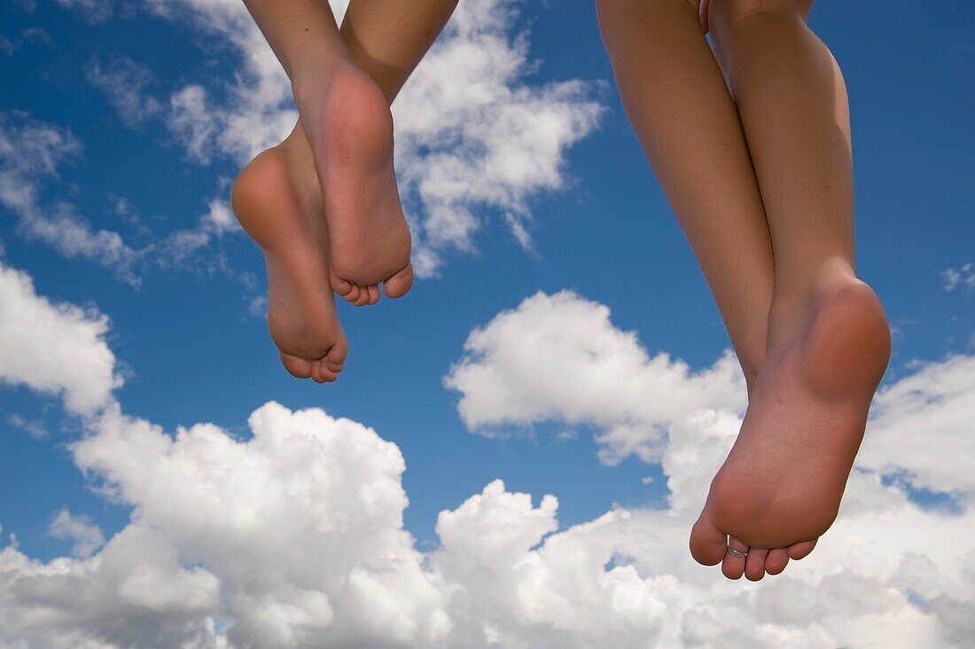 Angel Concept, Feet Floating In Sky Against Clouds