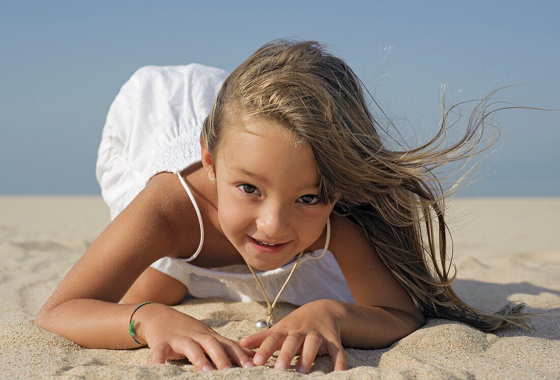Young Girl Playing On Beach