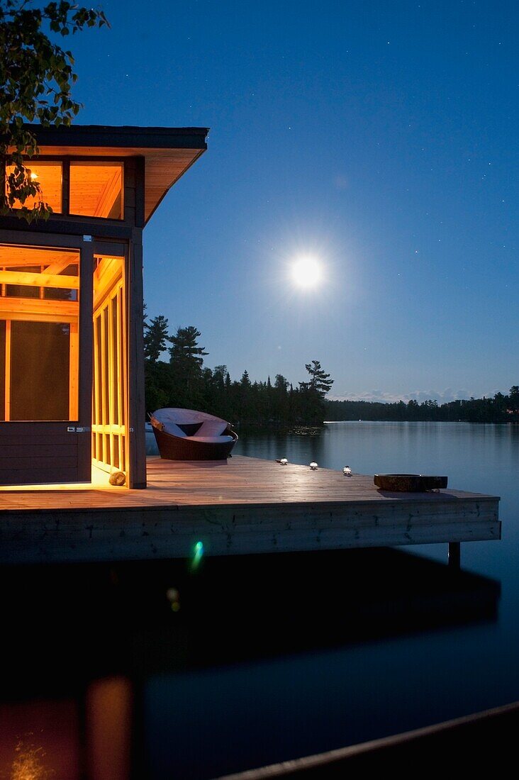 Cottage Exterior In Evening, Lake Of The Woods, Ontario, Canada