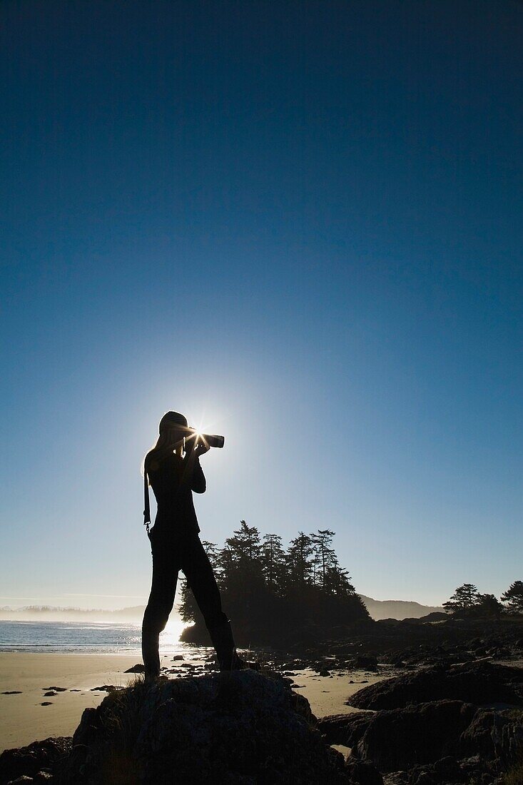 Young Woman Taking Photos, Chesterman's Beach, Tofino, British Columbia, Canada