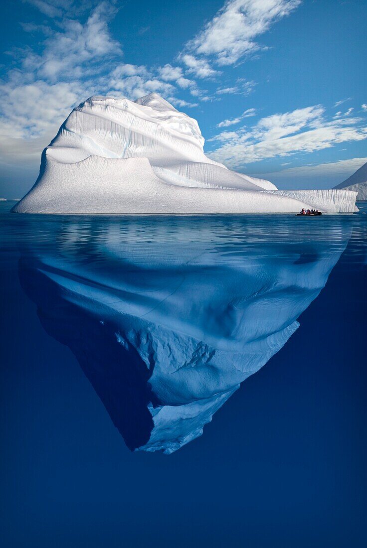 A Composite Image Of Tourists Exploring An Iceberg On Their Journey Throughout The Canadian Arctic, Nunavut, Canada