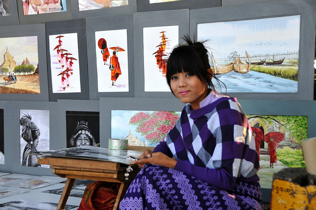 Artist with her works on the U Bein bridge, Amarapura near Mandalay, Myanmar, Burma, Asia