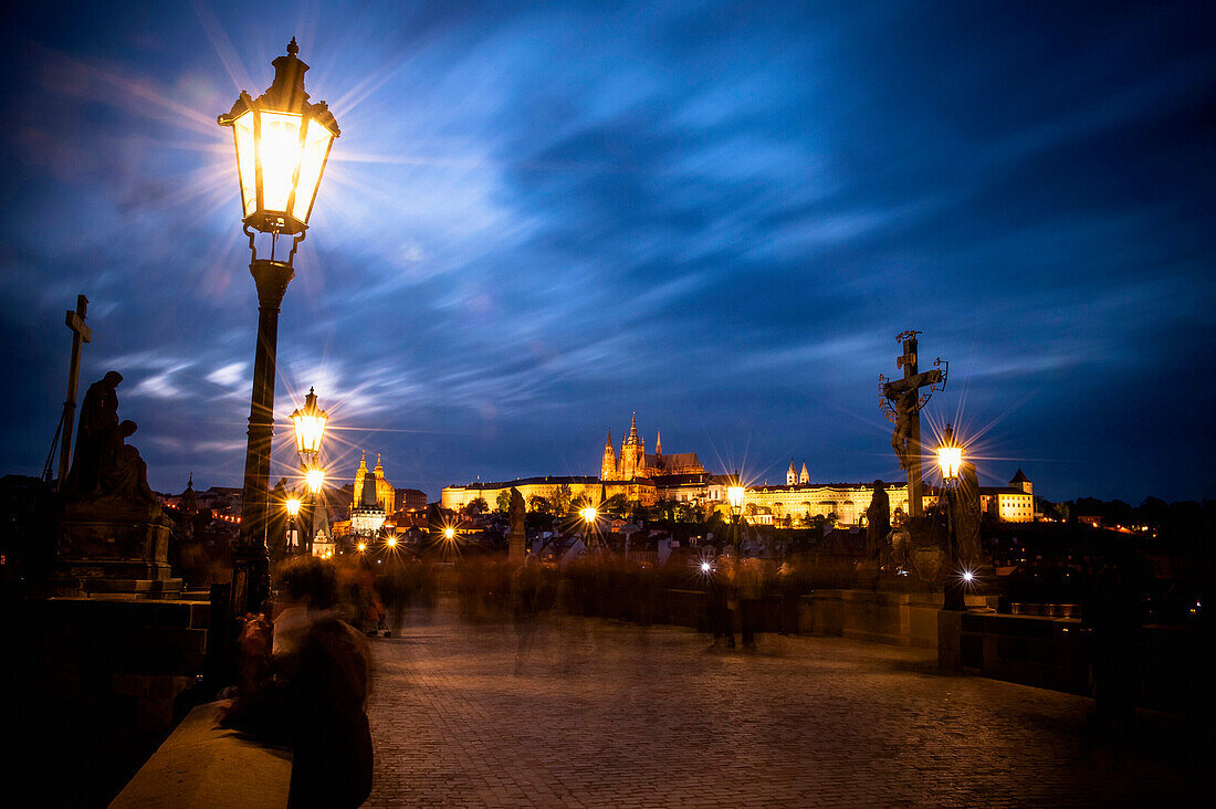 Charles bridge at dusk with view of the old town of Prague, Prague, Czech Republic