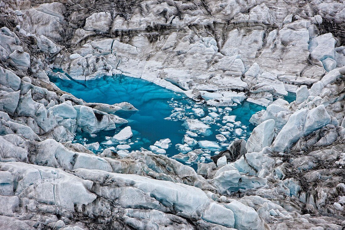 Icebergs in Jokulsarlon glacial lagoon, Breidamerkurjokull , Vatnajokull Ice Cap, Iceland  Images showing a glacial surge  A surge-type glacier has a dramatic increase in flow rate, that can be 10-100 times greater than normal flow rates