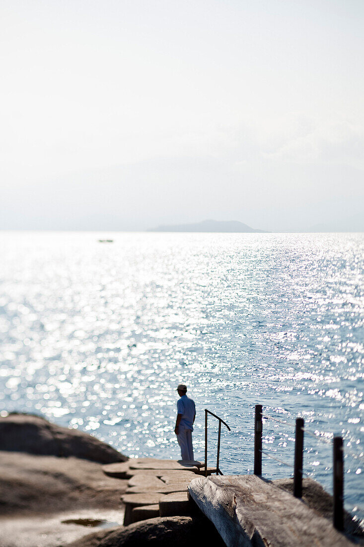 Man Standing at End of Pier, Nha Trang, Vietnam, Asia