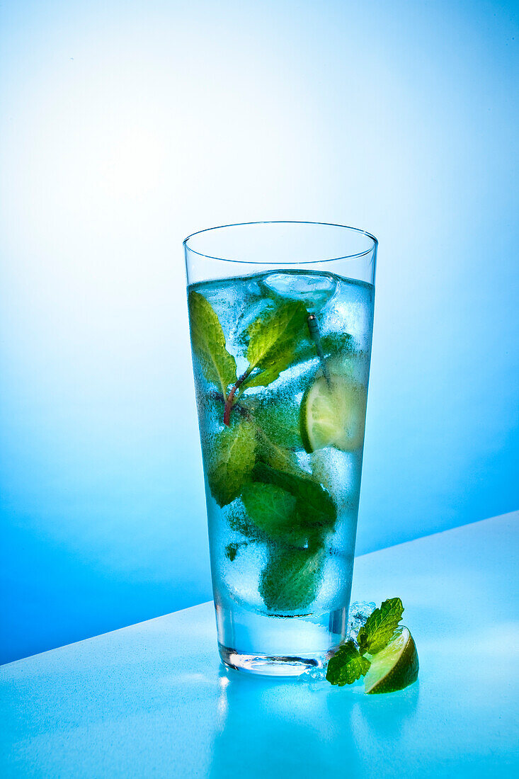 Tall Blue Drink With Peppermint, Lime and Ice