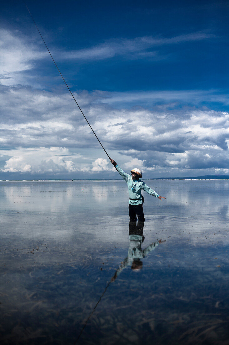 Man Fishing in Shallow Water, Bali, Indonesia