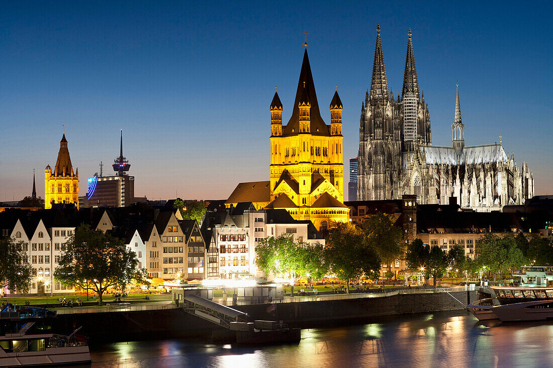 View over river Rhine to old town, Heumarkt with cathedral and Great St. Martin church, Cologne, North Rhine-Westphalia, Germany, Europe