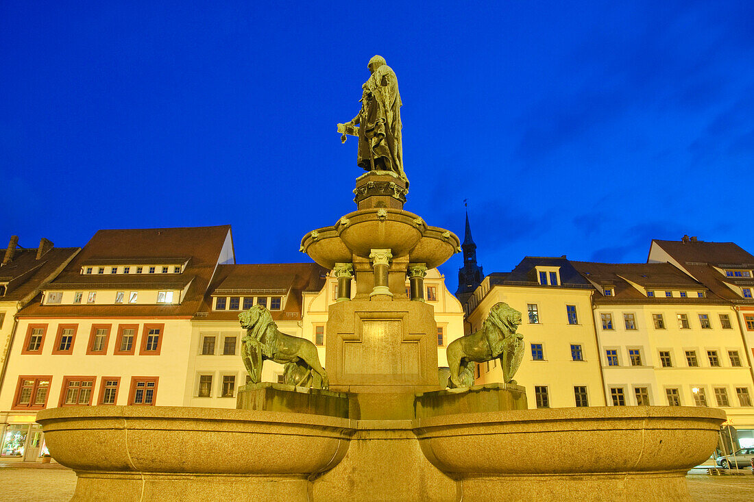 Obermarkt with fountain and monument of the founder of the town at dusk, Freiberg, Saxony, Germany, Europe